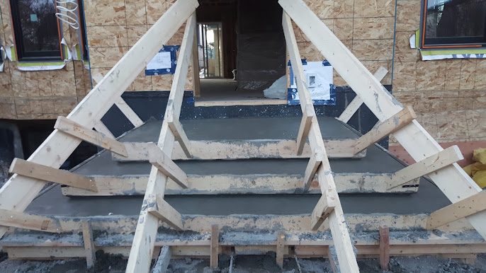 Concrete entry steps still inside wooden forms